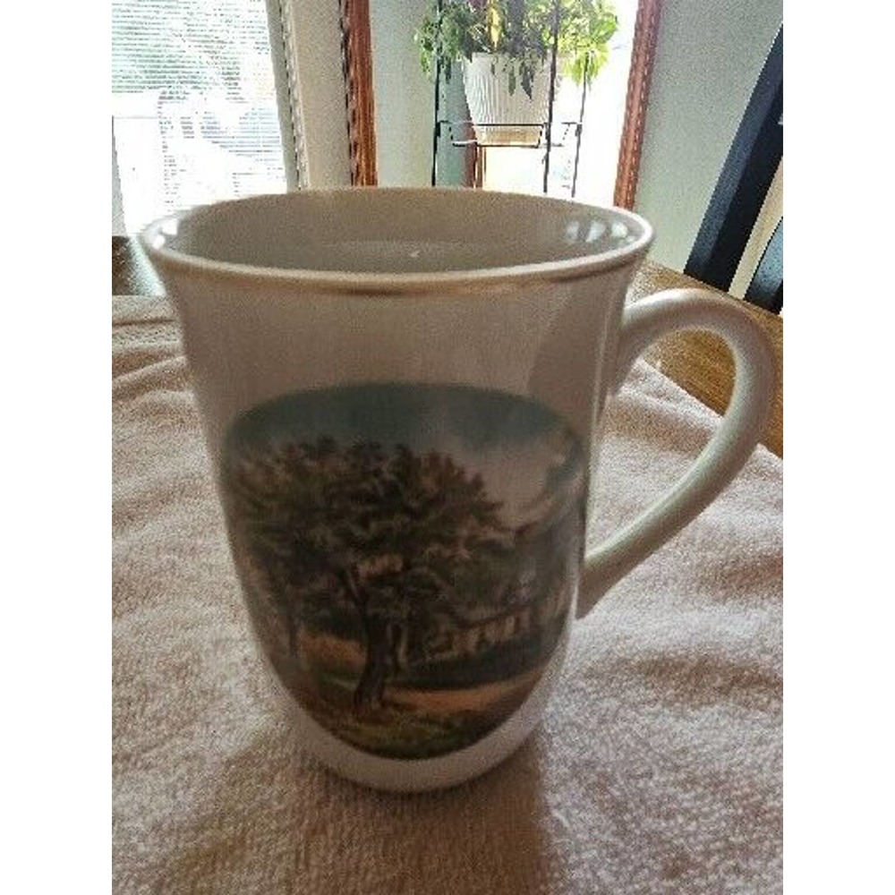 10 oz white porcelain Currier and Ives Autumn scene mug.